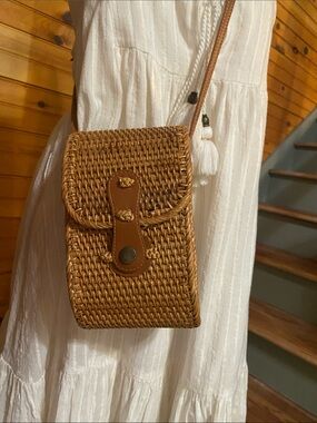 Small straw bag to carry essentials like a phone, wallet, cosmetics